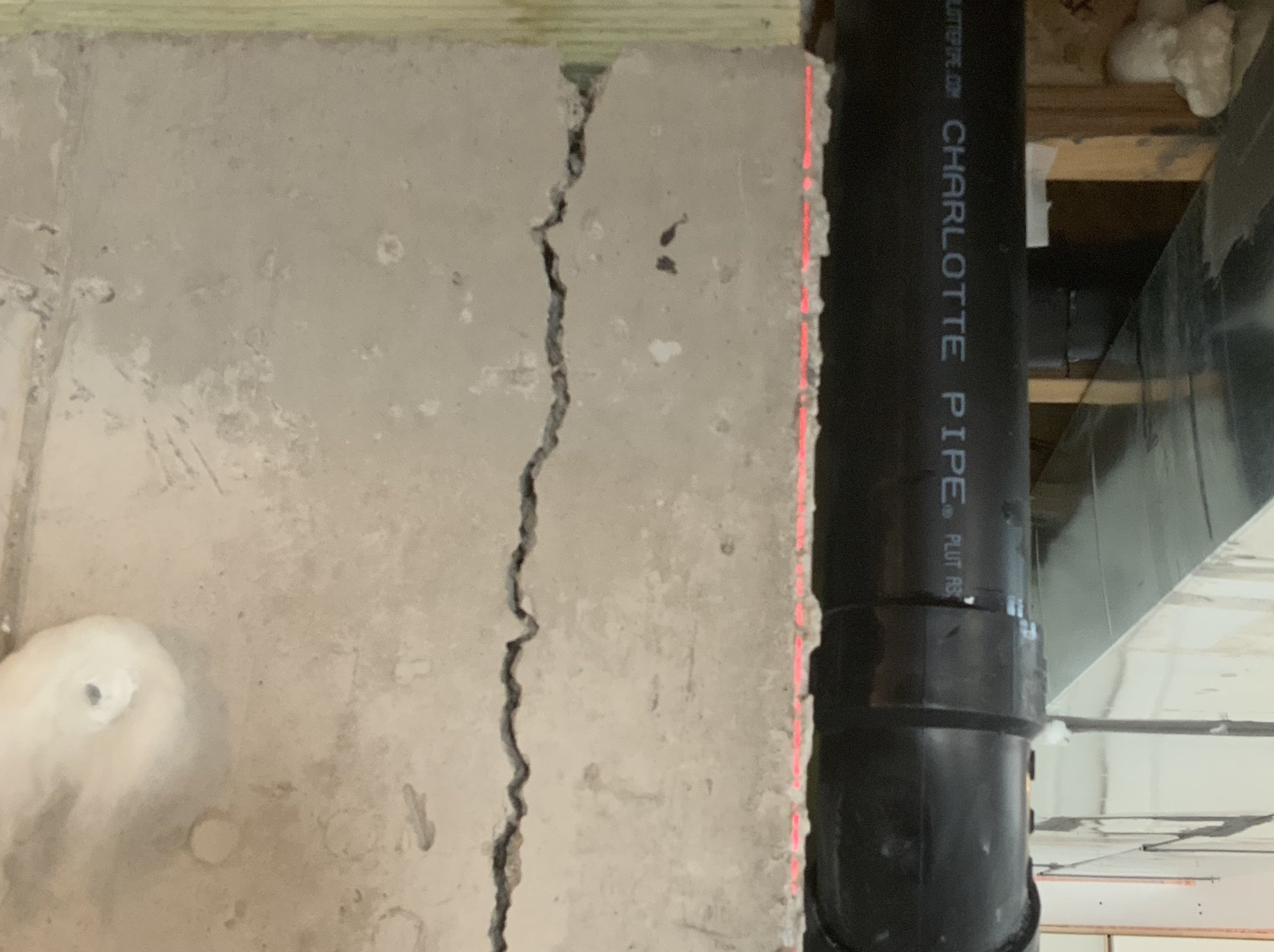 Double doors showing uneven gaps and signs of foundation settlement.