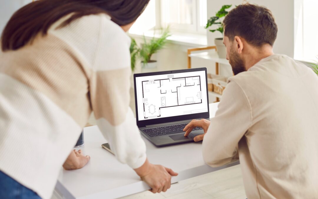 Couple looking at blueprint of architecture plan apartment set discussing engineering floor plan.