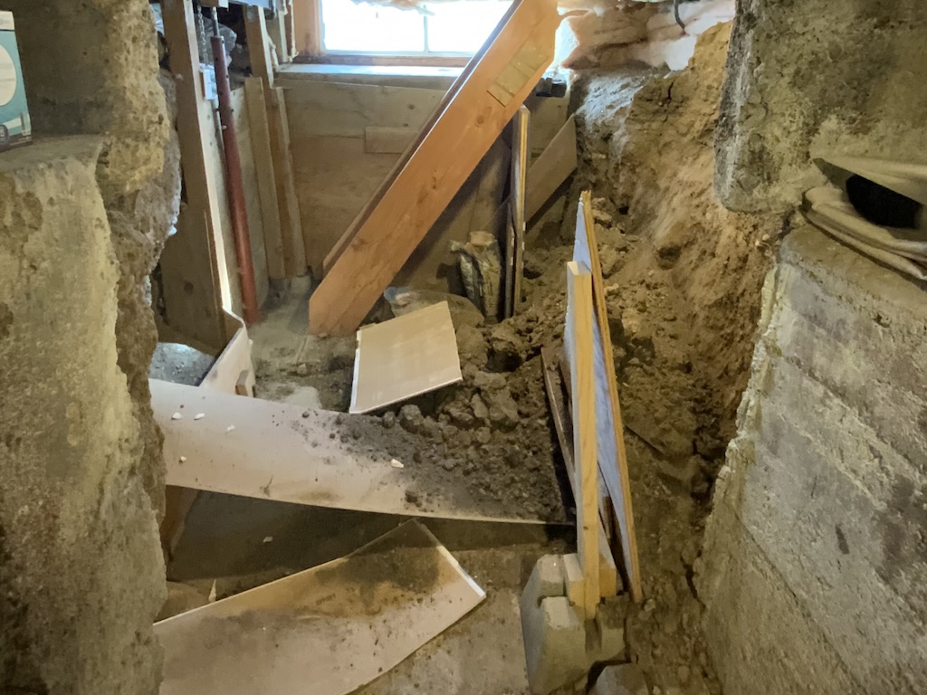 Foundation shoring collapse in basement.