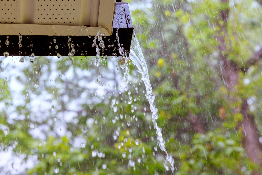Rain gutters on a house during a heavy downpour