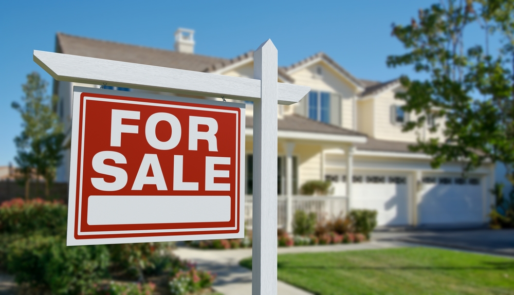 House with for sale sign
