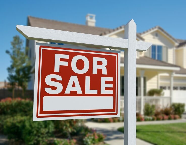 Home for Sale with a sign out front