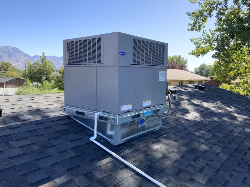 A/C Unit installed on a rooftop of a home.